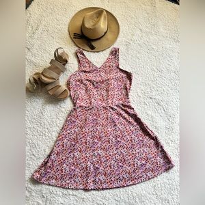 Flowery pink dress, with white and orange flowers and straps, never worn.